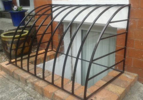 KH Metal Fabrication iron window guard